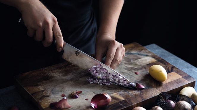 
                    Kitchen knife in use